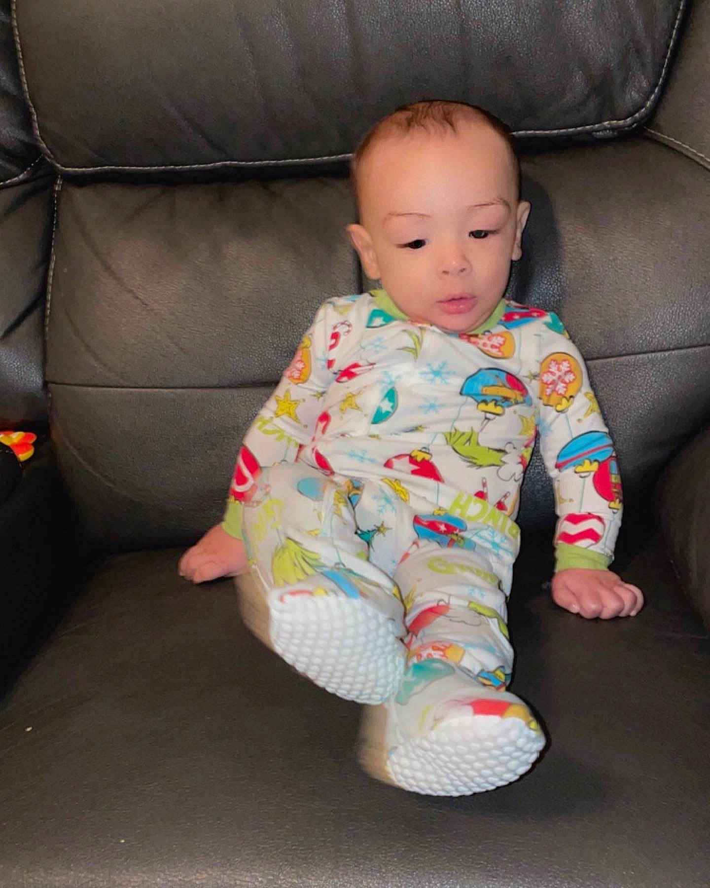 Carmelo is registered to the contest to win money with this photo: baby, baby_products, baby_toddler_clothing, car_seat, chair, cheek, child, comfort, couch, eye, face, floor, flooring, foot, head, pattern, person, sitting, sleeve, toddler