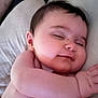 Elyna participe au concours pour gagner de l'argent avec cette photo : baby, sleeping, smile, arm, face, pillow, skin, child, peaceful, rest, closeup, infant, cute, relaxation, comfort, portrait, young, nap, indoors, soft