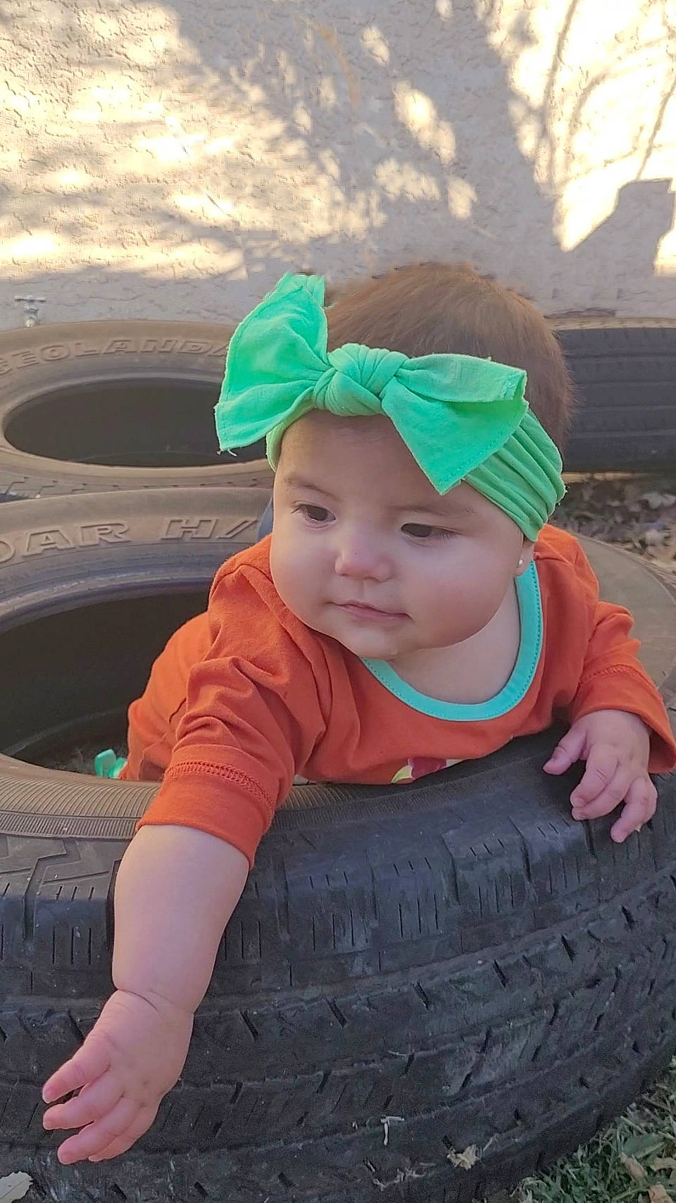 Alicia joined the competition — help win amazing prizes! automotive_tire, automotive_wheel_system, baby_toddler_clothing, baseball_cap, cap, eye, fun, grass, happy, hat, headgear, headwear, leisure, person, personal_protective_equipment, pink, recreation, sleeve, smile, tire