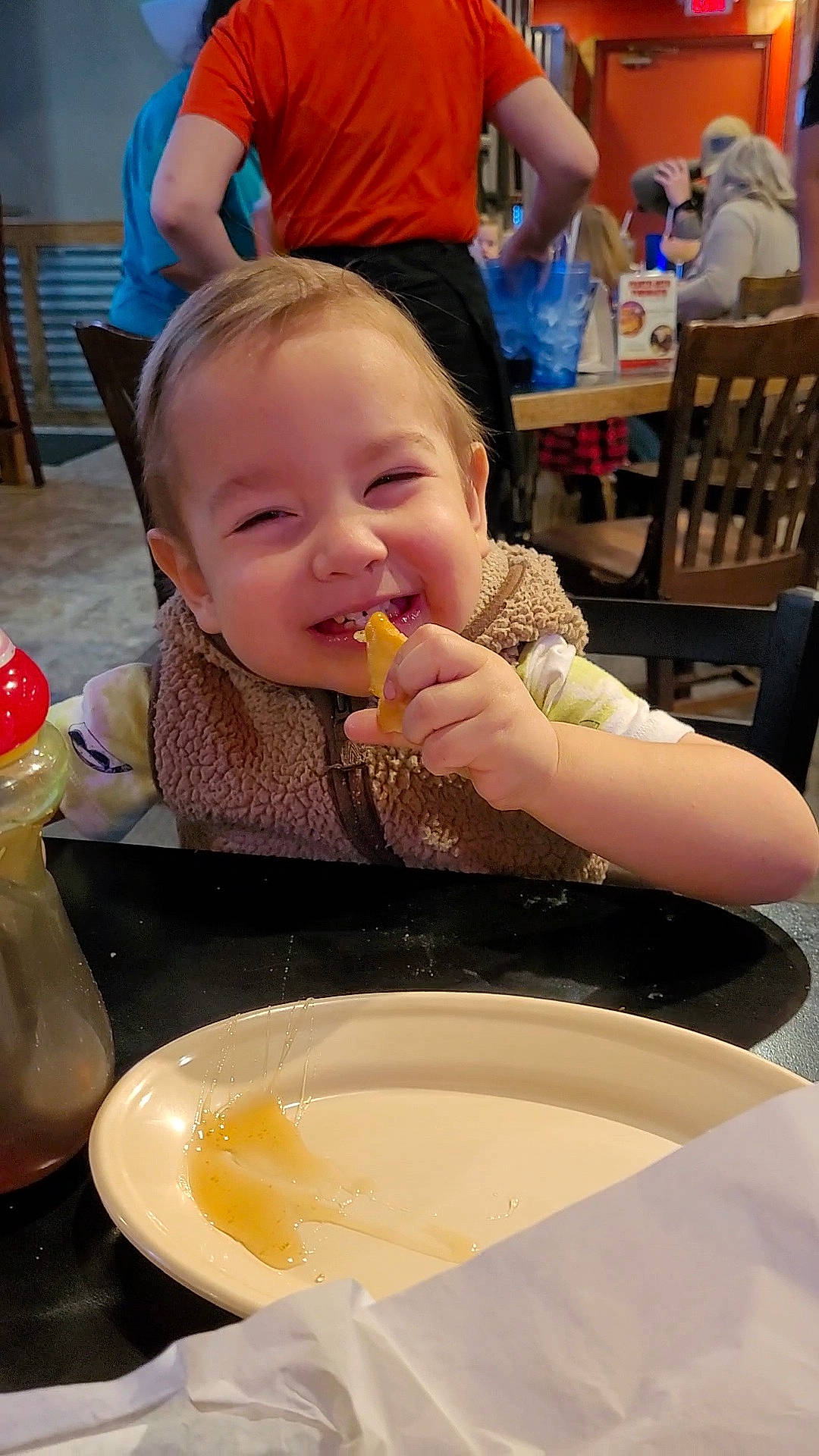 Levi is registered to the contest to win money with this photo: baby, bowl, breakfast, chair, child, comfort_food, cooking, cuisine, dish, dishware, eating, food, food_craving, ingredient, joy, person, plate, serveware, sharing, table