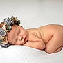 Maya is registered to the contest to win money with this photo: newborn, baby, sleeping, flower_crown, skin, infant, soft, blanket, peaceful, cute, portrait, resting, child, head, closeup, natural_light, sleep, baby_skin, toddler, naked