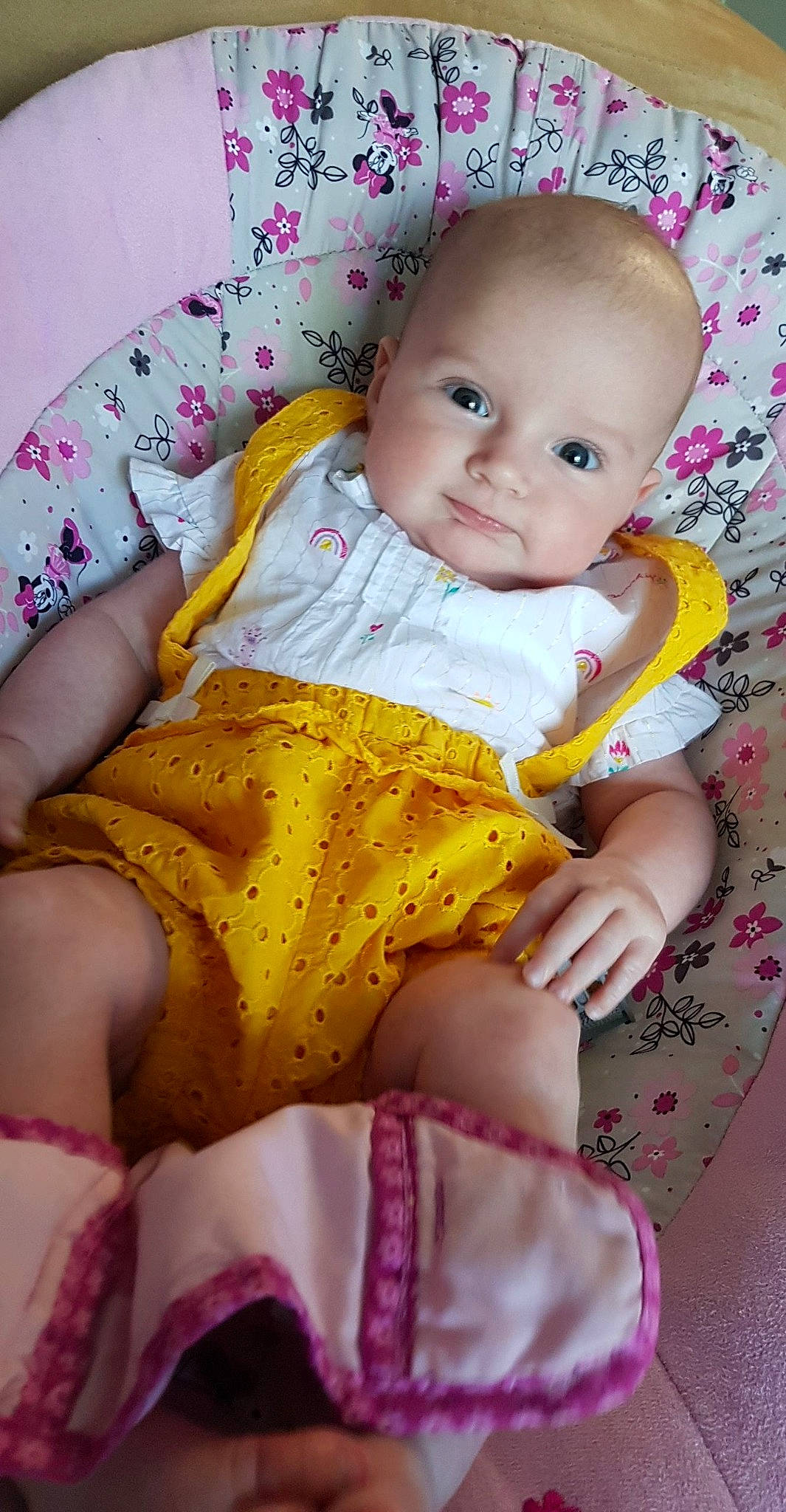 Elena participe au concours pour gagner de l'argent avec cette photo : baby, baby_products, baby_toddler_clothing, blanket, cheek, child, dress, iris, linens, nap_mat, person, pink, product, skin, smile, textile, toddler, yellow