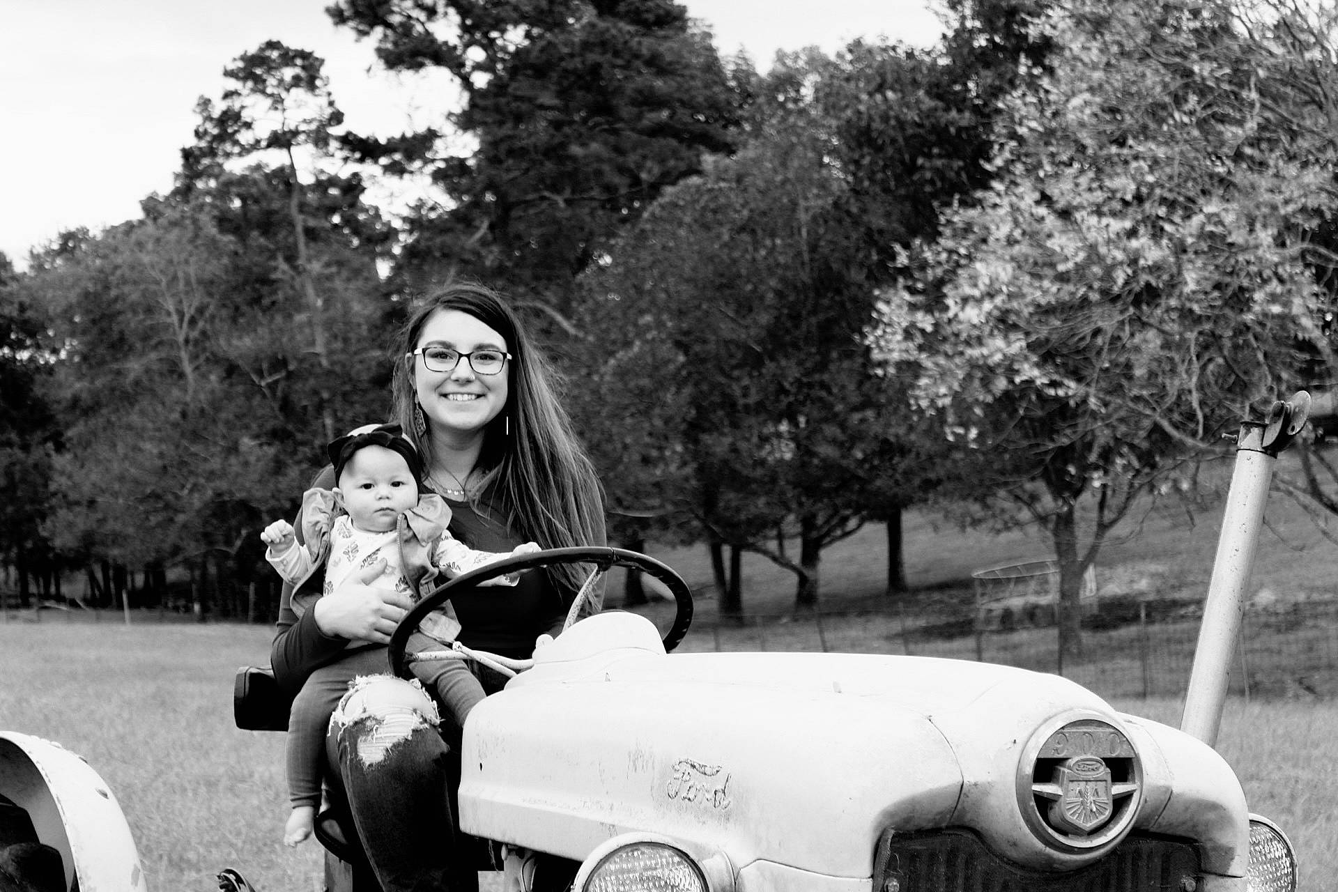 Wynonna is registered to the contest to win money with this photo: automotive_tire, black, black_and_white, car, fender, flash_photography, grass, happy, joy, monochrome, monochrome_photography, motor_vehicle, person, photograph, plant, smile, style, tire, tree, vehicle