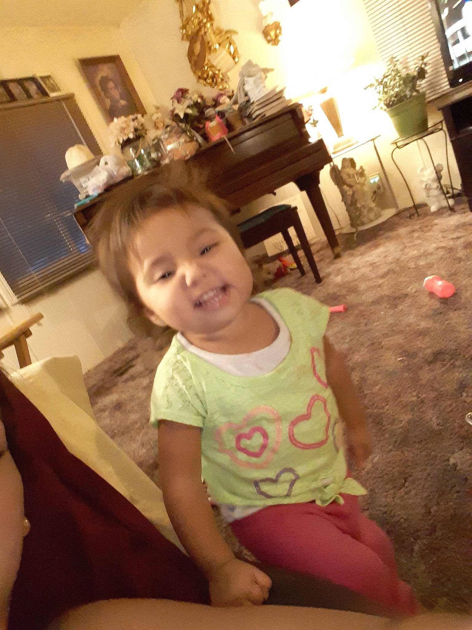 Evalina is registered to the contest to win money with this photo: chair, cheek, child, daughter, fun, furniture, happy, joy, leg, person, pink, room, selfie, shoulder, sitting, skin, smile, thigh, toddler, vacation