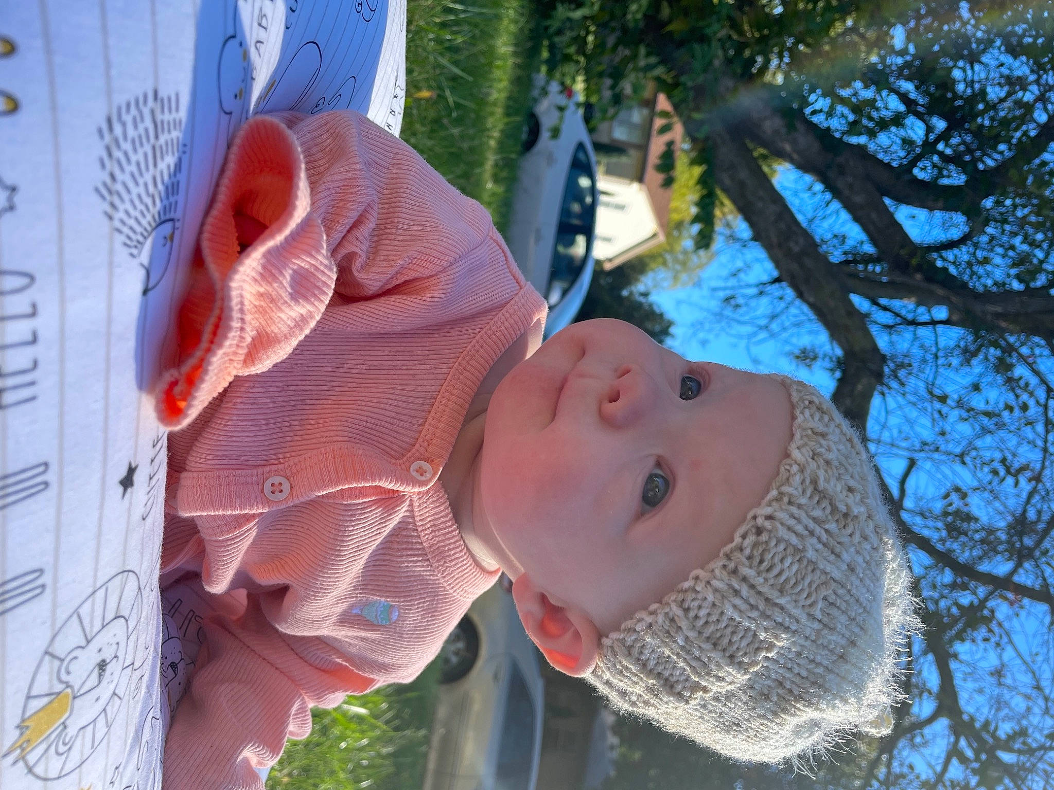 Adelaide is registered to the contest to win money with this photo: baby, child, daytime, eyewear, fun, grass, happy, hat, headwear, leisure, mouth, organism, people_in_nature, person, plant, sky, smile, sun_hat, t_shirt, toddler