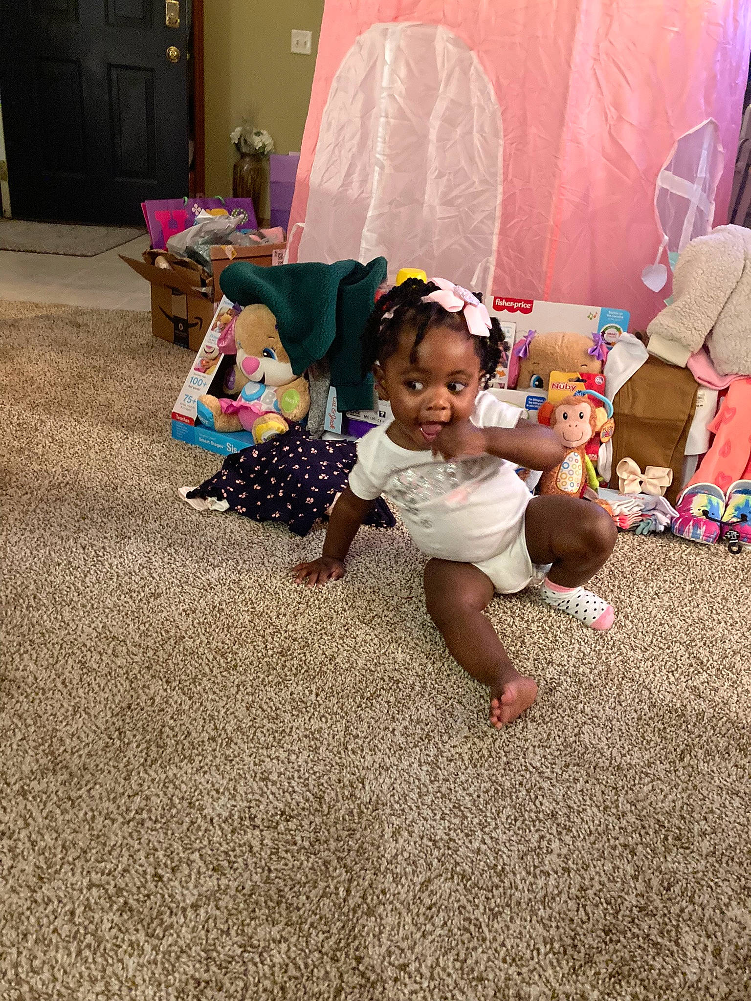 Ayva joined the competition — help win amazing prizes! baby, child, door, event, floor, flooring, fun, grass, happy, human_leg, leg, leisure, person, plant, play, room, sandal, sitting, toddler, tree