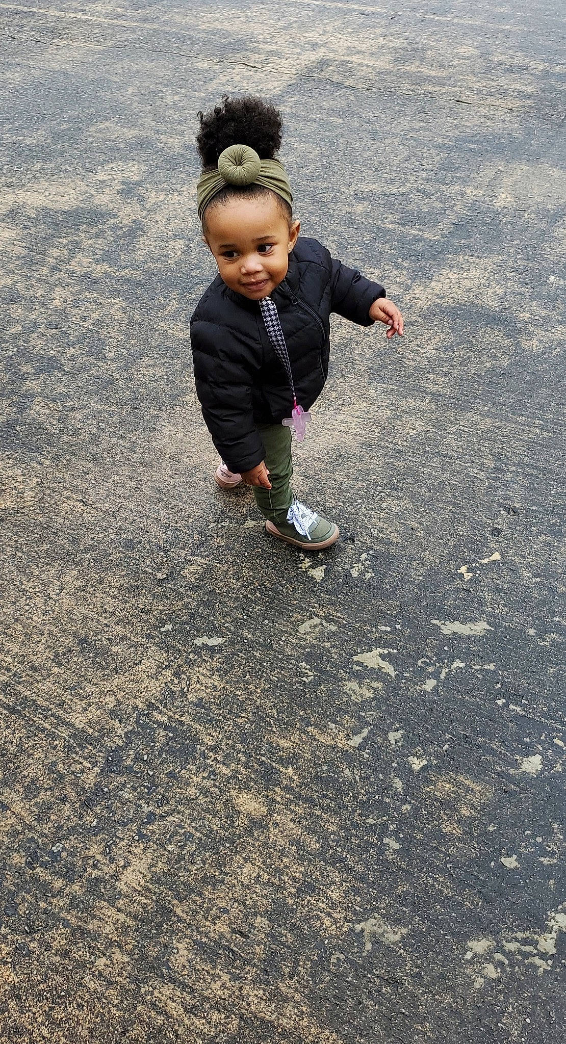 Londynn is registered to the contest to win money with this photo: asphalt, baby, child, fun, gesture, grass, happy, joy, landscape, leisure, people_in_nature, person, recreation, road, road_surface, sand, shadow, soil, tar, toddler