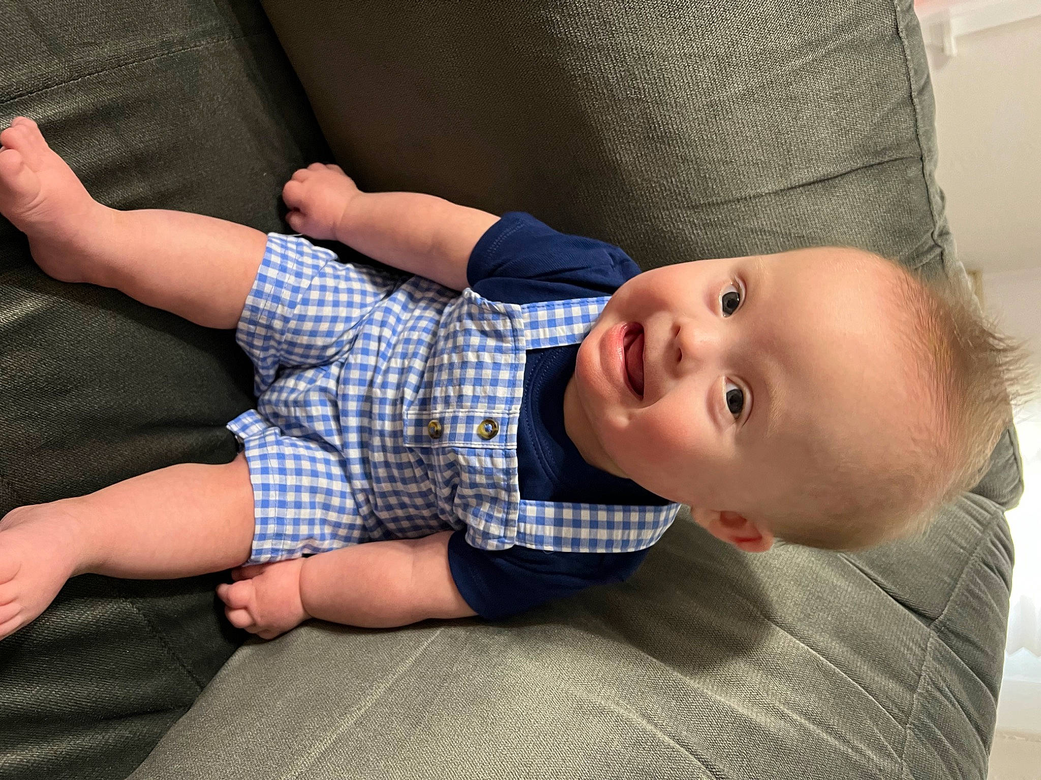 Roberto joined the competition — help win amazing prizes! arm, baby, baby_toddler_clothing, child, comfort, elbow, finger, hand, hat, human, lip, pattern, person, plaid, product, skin, sleeve, smile, sun_hat, tartan