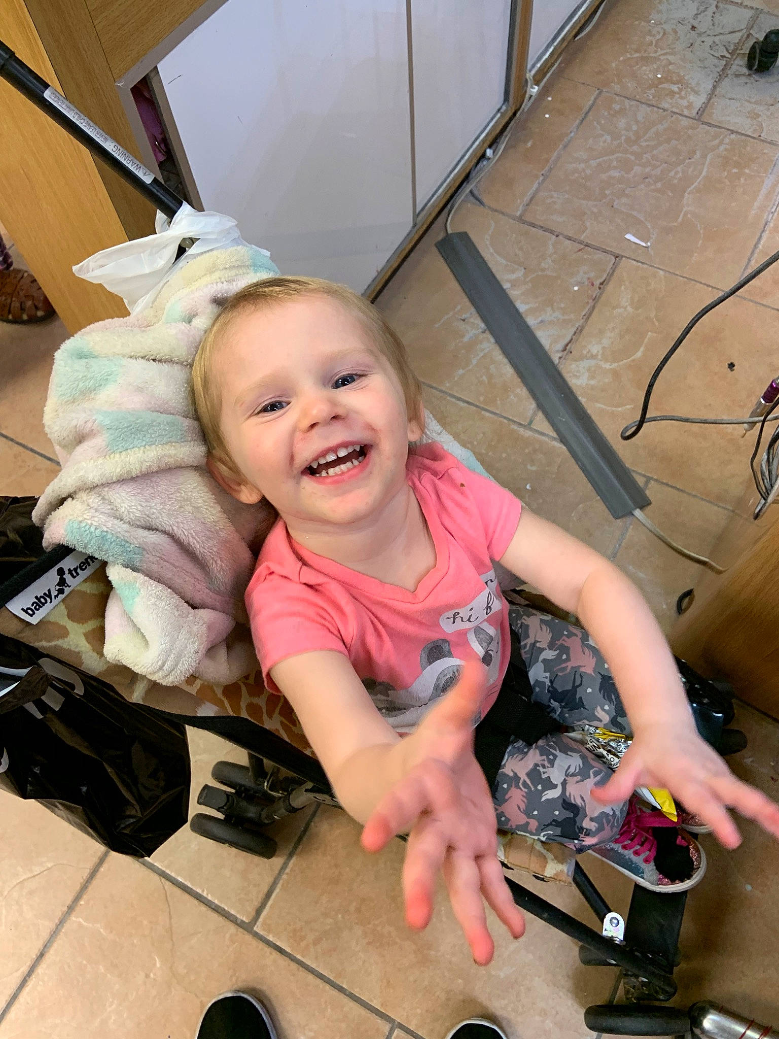 Emma is registered to the contest to win money with this photo: baby, cheek, child, daughter, facial_expression, fun, happy, joy, person, pink, play, skin, smile, technology, toddler, tooth, vacation