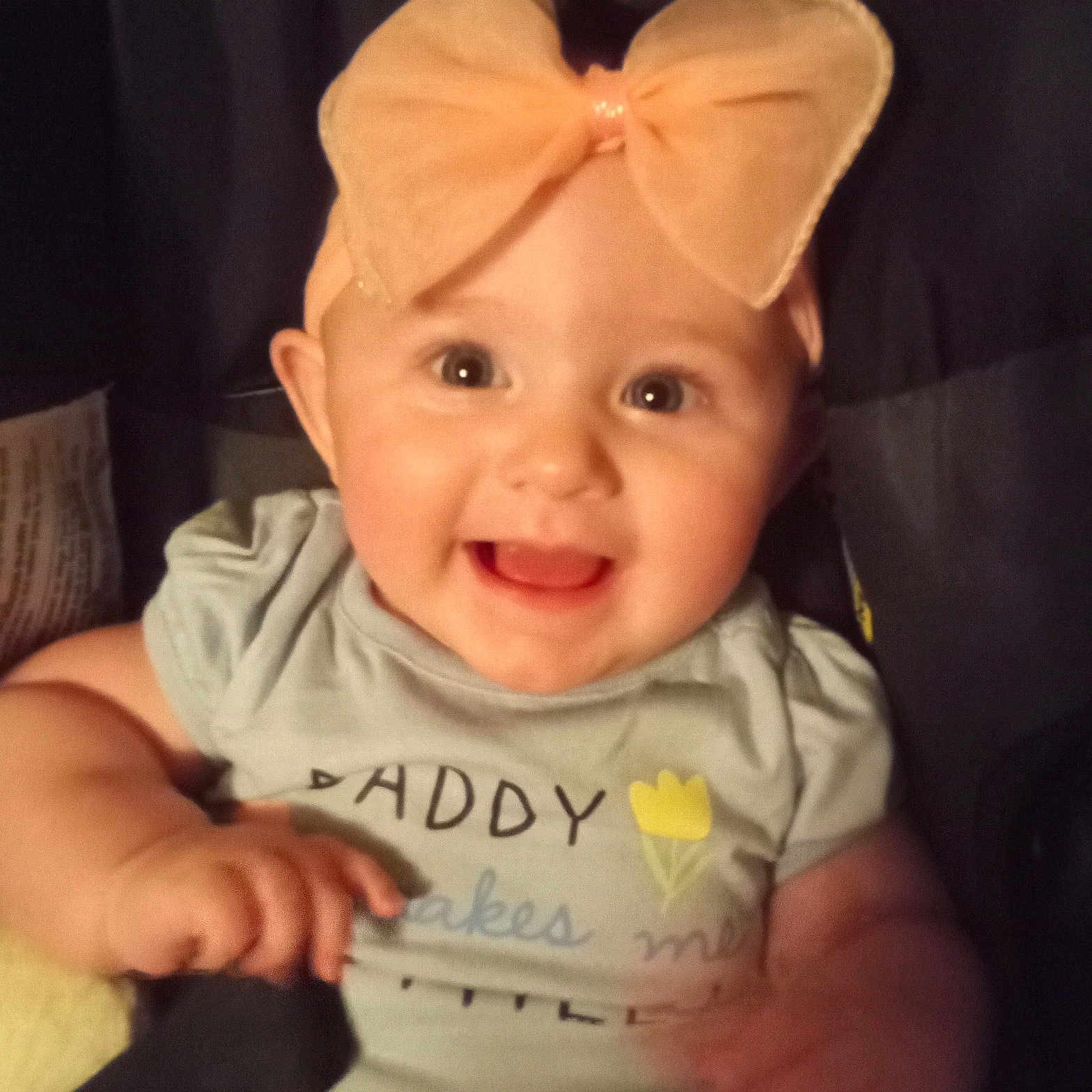 Lorabeth joined the competition — help win amazing prizes! baby, child, bow, headband, smile, happy, infant, toddler, clothing, face, portrait, cute, cheerful, sitting, indoor, person, light, background, expression, young