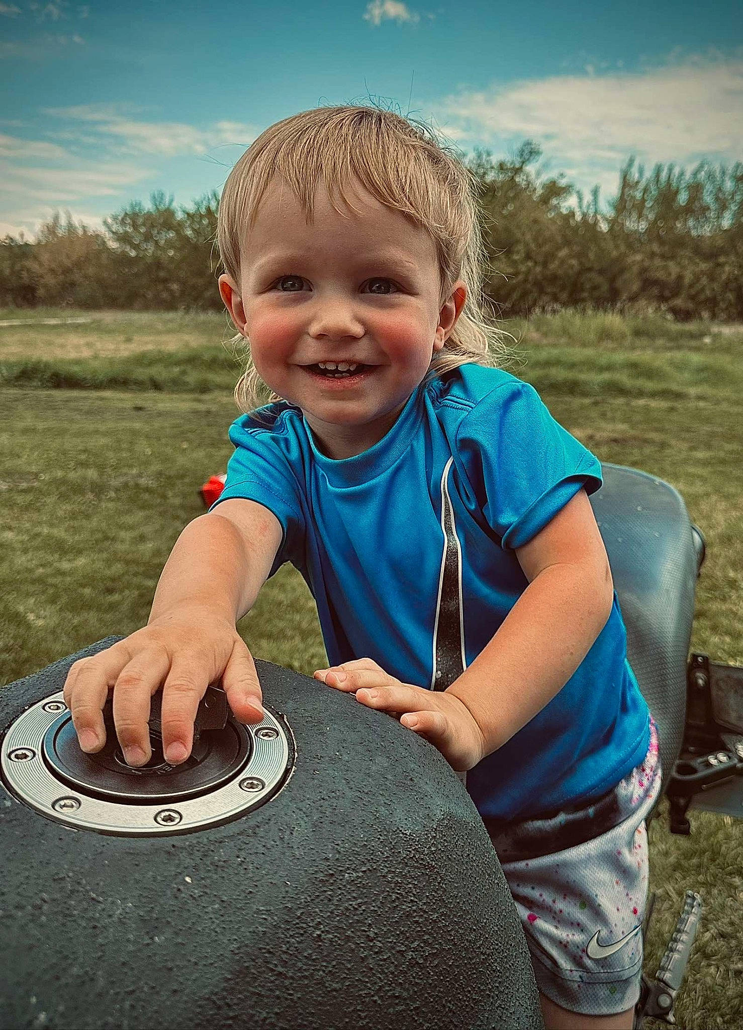 Remington joined the competition — help win amazing prizes! automotive_tire, automotive_wheel_system, cloud, cool, electric_blue, flash_photography, fun, grass, happy, joy, leisure, people_in_nature, person, plant, sitting, sky, smile, t_shirt, tire, toddler