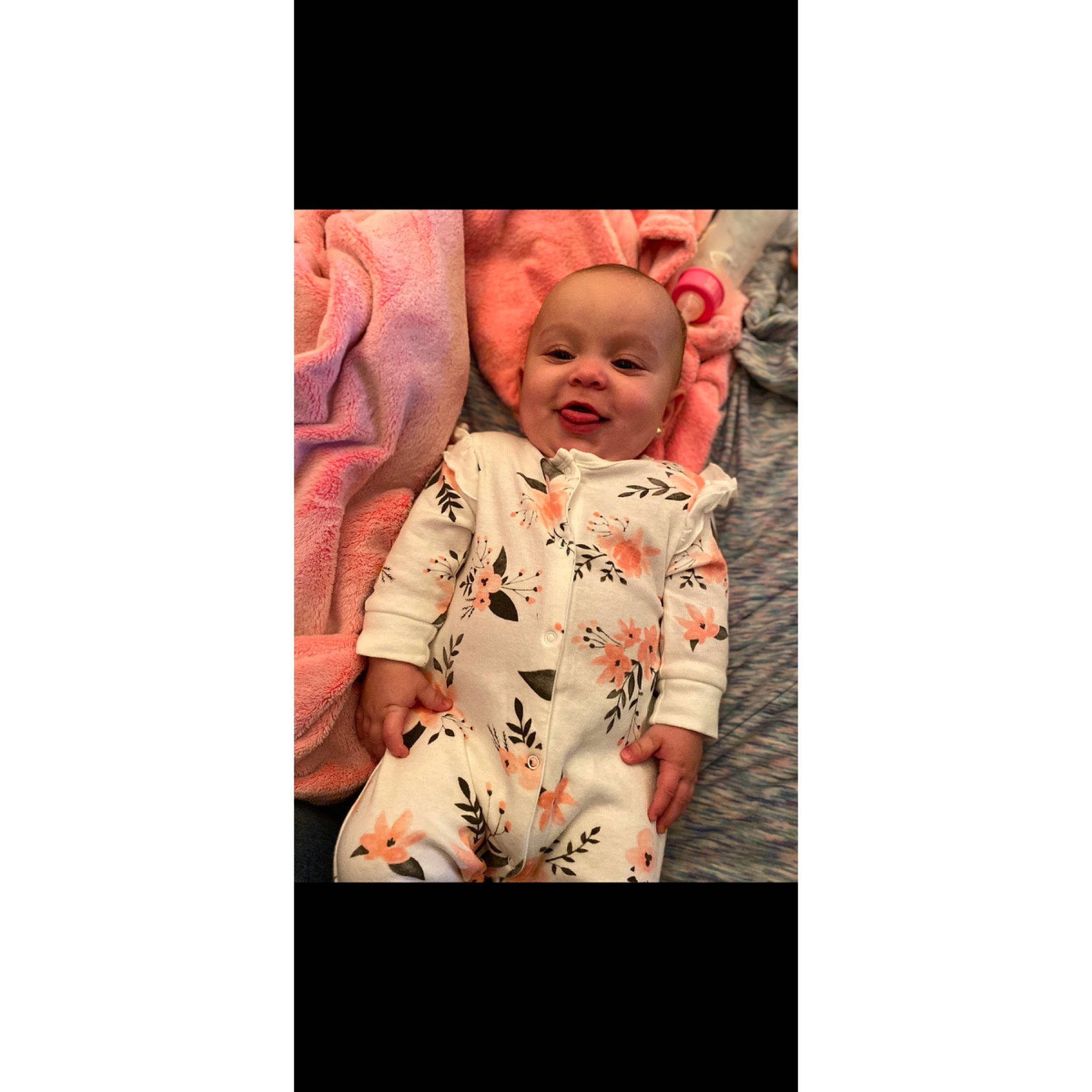 Gabriella is registered to the contest to win money with this photo: baby, baby_laughing, baby_toddler_clothing, child, human, nightwear, peach, person, portrait_photography, sleeve, toddler