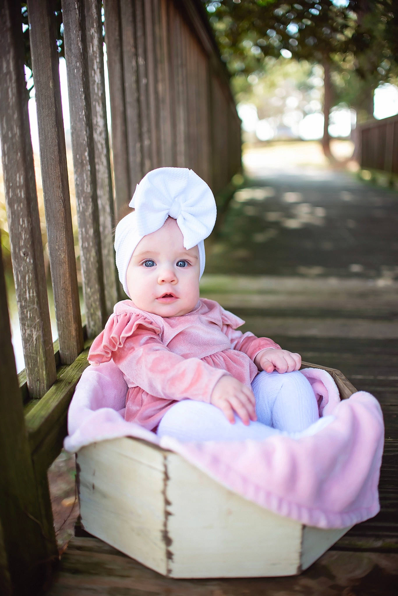 Stella is registered to the contest to win money with this photo: baby, baby_toddler_clothing, cap, chair, child, dress, fashion_accessory, flash_photography, fun, grass, happy, hat, headwear, leisure, pattern, peach, person, pink, plant, sitting