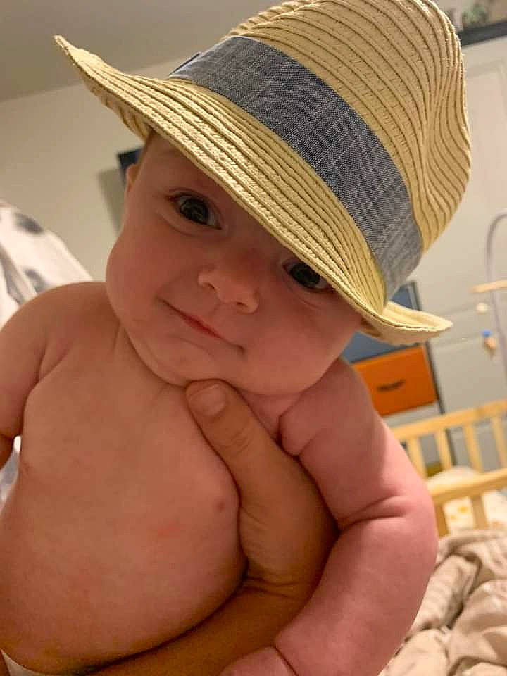 Jaxon is registered to the contest to win money with this photo: baby, cap, cheek, chest, child, comfort, eye, face, fashion_accessory, fedora, fun, gesture, happy, hat, headgear, headwear, lip, person, skin, sun_hat
