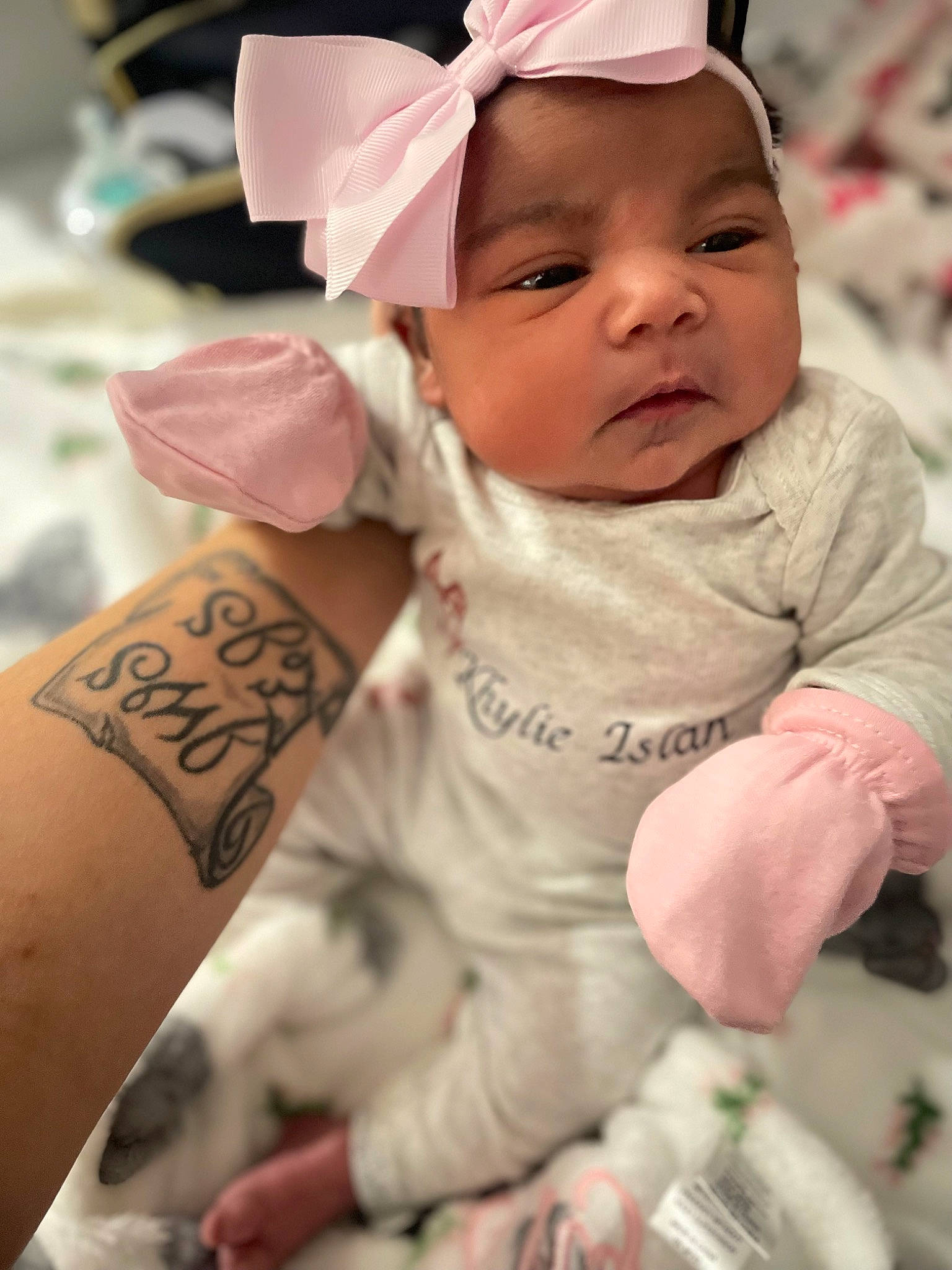 Khylie is registered to the contest to win money with this photo: baby, baby_toddler_clothing, cap, cheek, dress, eye, face, finger, happy, hat, head, human_body, lip, person, photograph, pink, skin, sleeve, temporary_tattoo, toddler