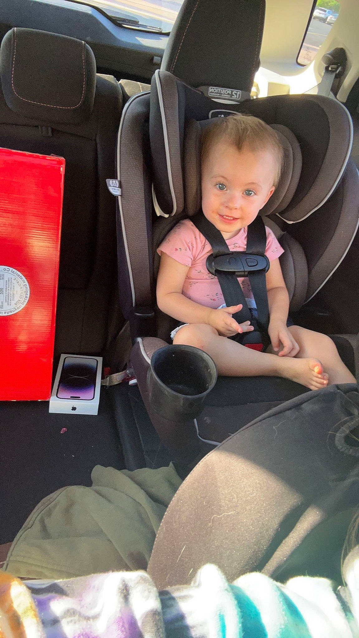 Aerilyn is registered to the contest to win money with this photo: arm, auto_part, automotive_design, automotive_exterior, automotive_tire, automotive_wheel_system, car, car_seat, car_seat_cover, comfort, head_restraint, human_leg, leg, mode_of_transport, motor_vehicle, person, steering_part, steering_wheel, toddler, vehicle