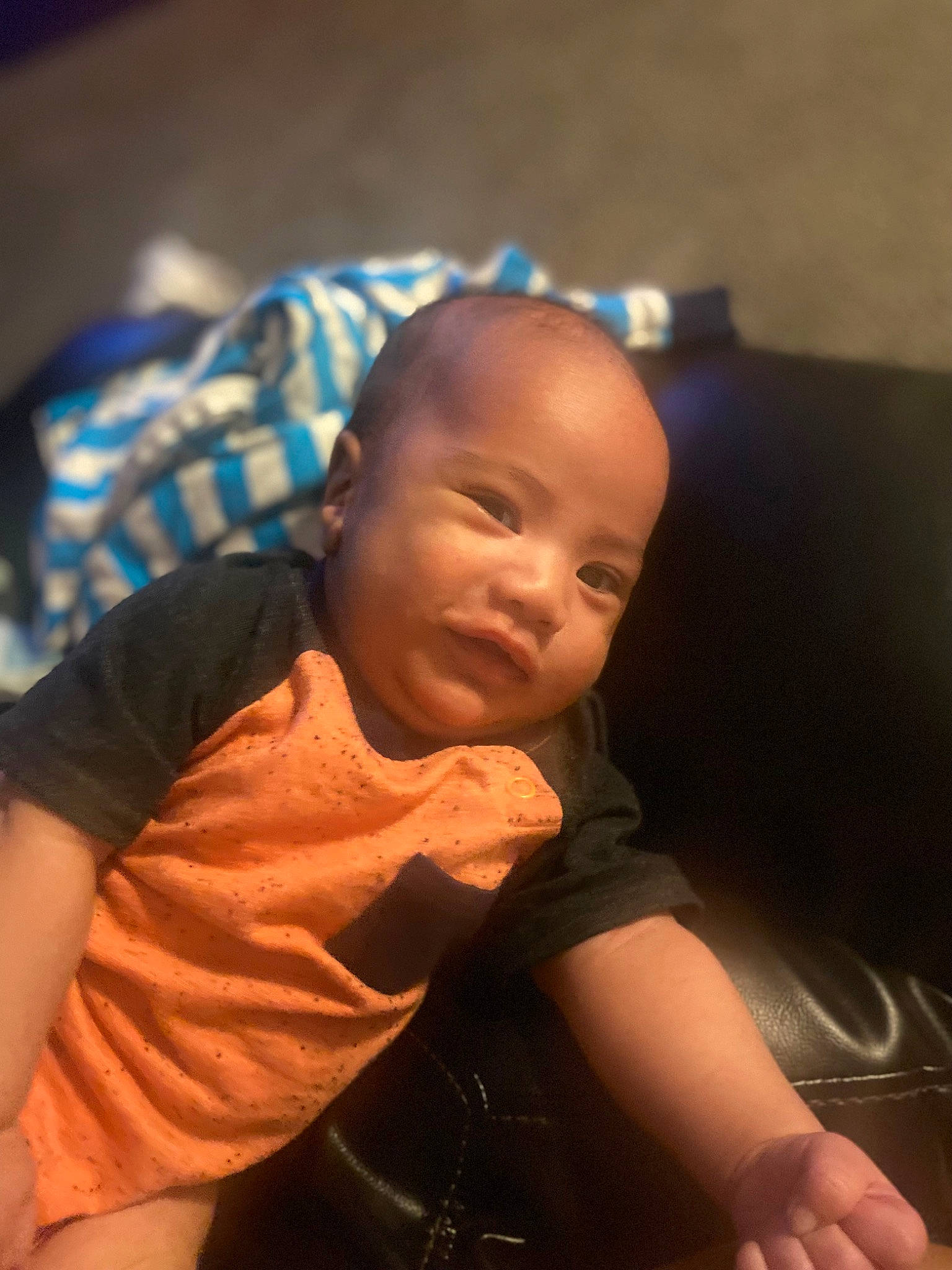 King is registered to the contest to win money with this photo: arm, baby, baby_toddler_clothing, cheek, child, comfort, elbow, eye, finger, flash_photography, fun, happy, head, mouth, nose, person, skin, sleeve, smile, t_shirt