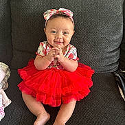 Maharmony joined the competition — help win amazing prizes! baby, child, tutu, red_dress, headband, smiling, couch, indoor, happy, cute, sitting, infant, clothing, portrait, feet, hands, face, person, fabric, home