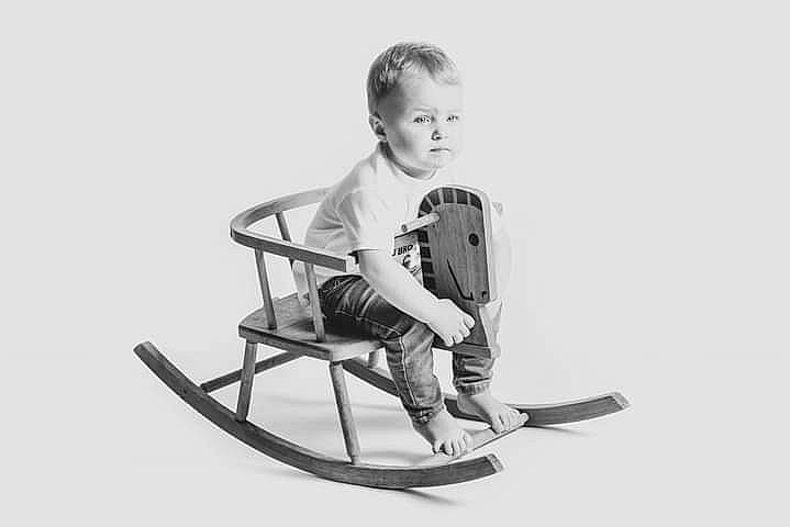 William is registered to the contest to win money with this photo: baby, baby_toddler_clothing, chair, child, comfort, elbow, flash_photography, folding_chair, font, happy, monochrome, monochrome_photography, outdoor_furniture, person, play, portrait_photography, shorts, sitting, sleeve, t_shirt