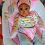 Journey is registered to the contest to win money with this photo: baby, infant, pink, headband, bow, jeans, floral, clothing, baby_seat, toy, face, wide_eyes, cute, child, indoor, soft_toys, socks, happy, casual_wear, portrait