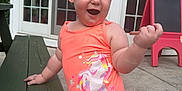 Maya joined the competition — help win amazing prizes! toddler, child, swimsuit, orange, unicorn, mermaid, bench, outdoor, happy, smiling, concrete, chalkboard, easel, door, window, glass, person, play, summer, daylight