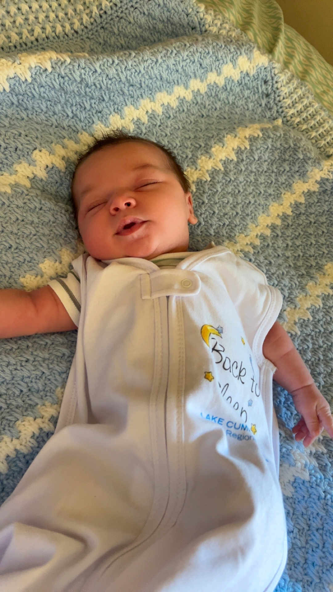 Dexter is registered to the contest to win money with this photo: baby, sleeping, blanket, knitted, onesie, infant, resting, cozy, cute, toddler, child, soft, blue, white, clothing, peaceful, portrait, indoor, newborn, face