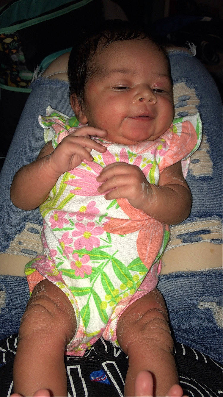 Nevaeh joined the competition — help win amazing prizes! baby, baby_toddler_clothing, black, cheek, chin, comfort, eye, finger, gesture, happy, head, iris, lip, mouth, neck, nose, person, pink, purple, skin