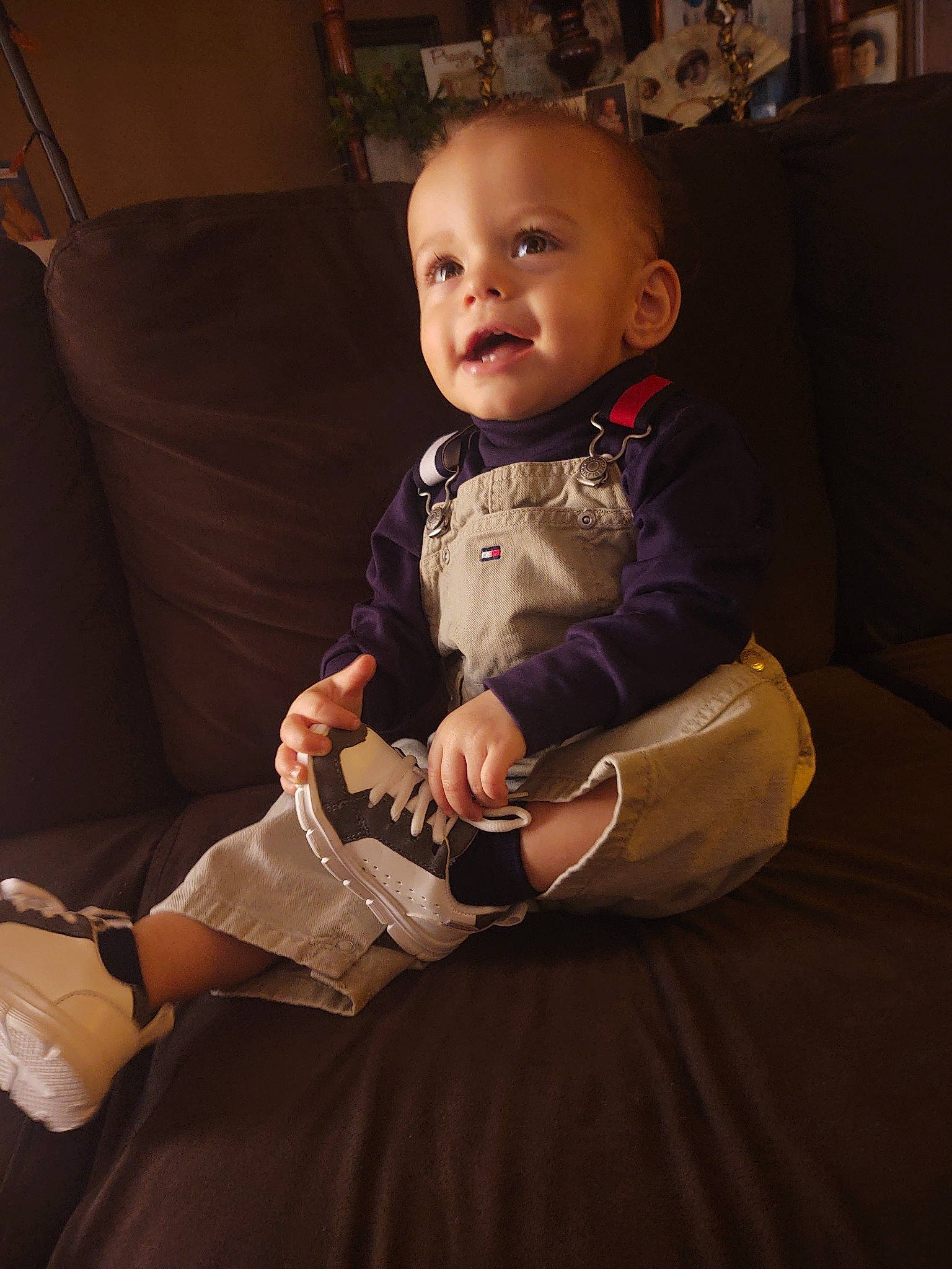 Liam joined the competition — help win amazing prizes! baby, baby_toddler_clothing, cheek, child, comfort, couch, finger, flooring, human_leg, knee, lap, person, picture_frame, sitting, skin, smile, sock, thigh, toddler, watch