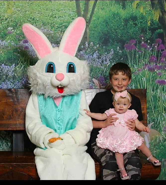 Emma is registered to the contest to win money with this photo: baby_toddler_clothing, domestic_rabbit, ear, easter_bunny, event, fun, grass, happy, hare, holiday, joy, organ, pattern, person, pink, plant, rabbit, rabbits_and_hares, skin, smile