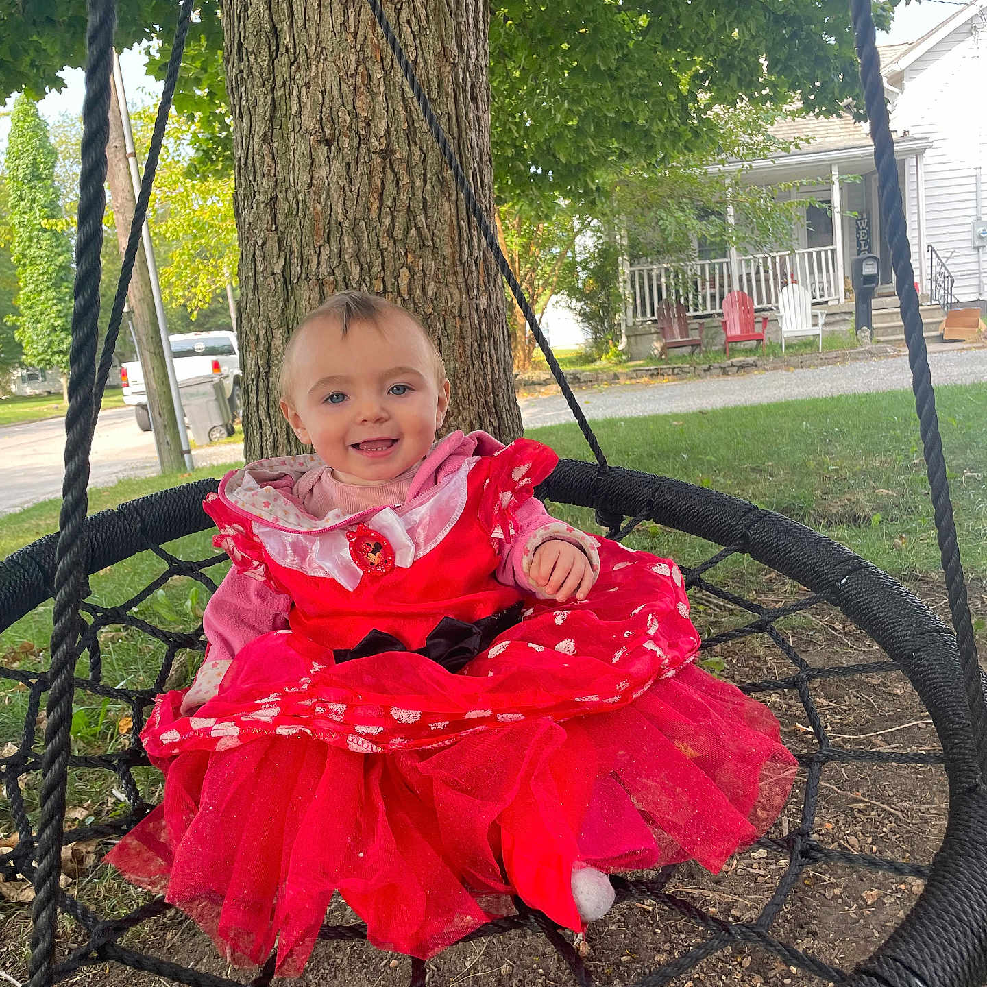 Legacy joined the competition — help win amazing prizes! casual_clothing, child, daylight, grass, ground, happy, house, lawn_chairs, nature, outdoor, park, person, play, porch, red_dress, rope_swing, smiling, swing, toddler, tree