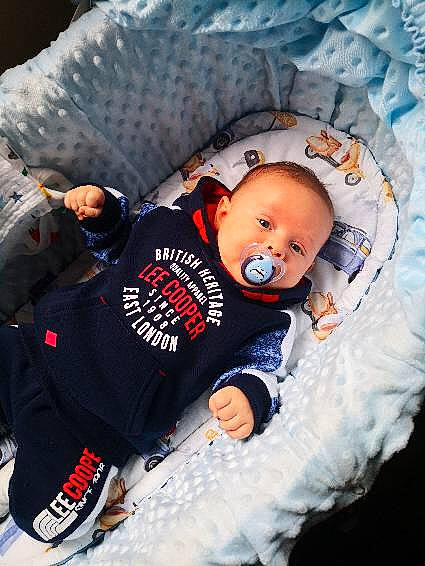 Albert is registered to the contest to win money with this photo: baby, baby_products, baby_sleeping, baby_toddler_clothing, bed, bedding, bedtime, carmine, child, comfort, freezing, fun, linens, pattern, person, sitting, sleeve, textile, toddler, winter