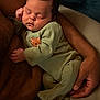 arm, baby, child, closeup, comfort, cozy, cuddle, green_clothing, hand, indoor, infant, love, onesie, parent, peaceful, portrait, resting, skin, sleeping, tiger_patch