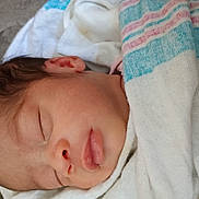 Amiri is registered to the contest to win money with this photo: newborn, baby, sleeping, blanket, closeup, face, infant, soft, peaceful, wrapped, child, person, cute, resting, skin, ear, nose, mouth, head, quiet