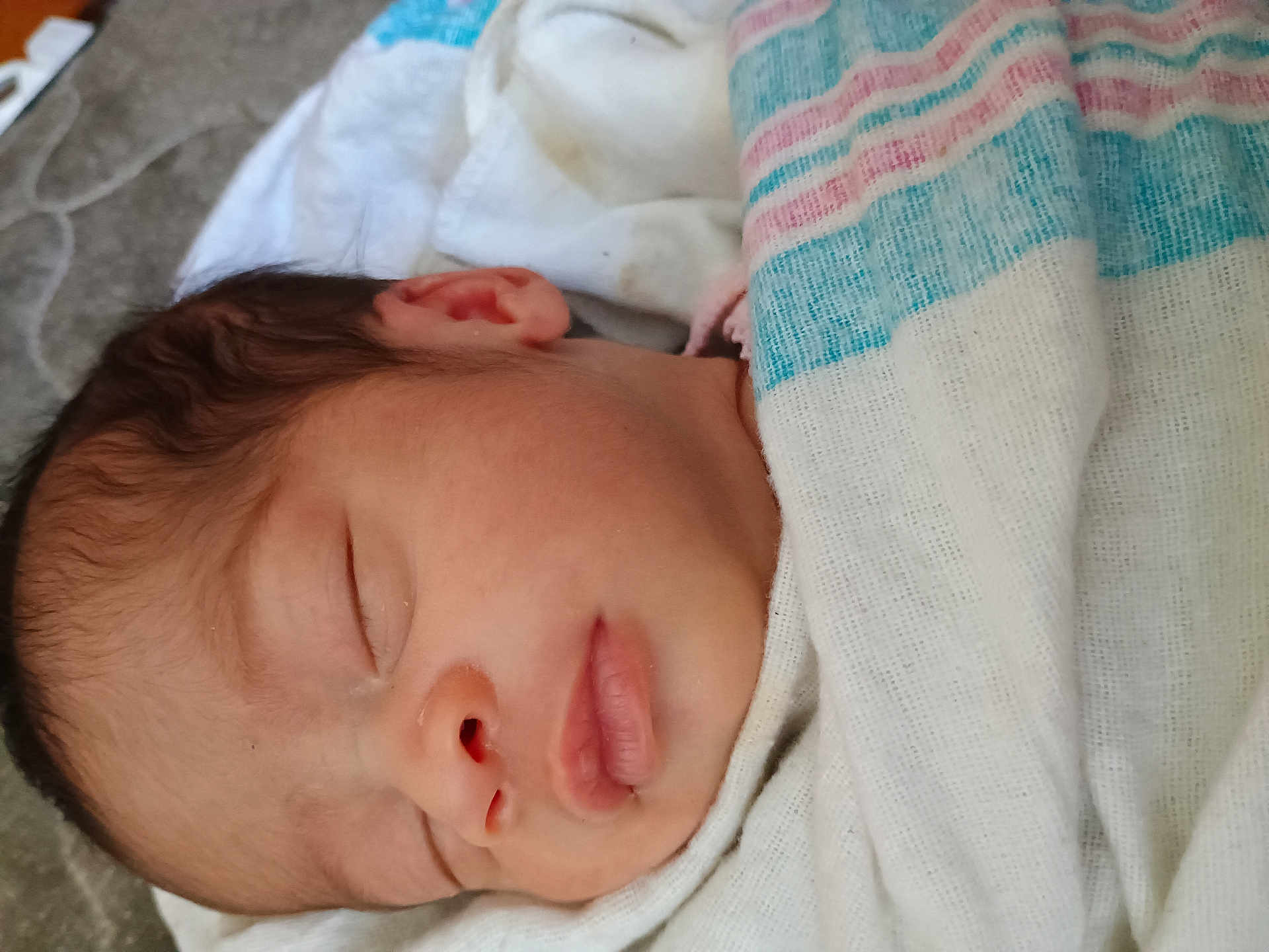 Amiri is registered to the contest to win money with this photo: newborn, baby, sleeping, blanket, closeup, face, infant, soft, peaceful, wrapped, child, person, cute, resting, skin, ear, nose, mouth, head, quiet