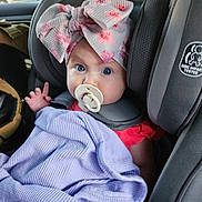 Lorraina is registered to the contest to win money with this photo: alloywheel, baby, blanket, bonnet, cap, car, car_interior, carseat, clothing, cushion, face, hat, head, homedecor, person, photography, portrait, sitting, transportation, vehicle
