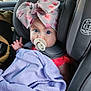 alloywheel, baby, blanket, bonnet, cap, car, car_interior, carseat, clothing, cushion, face, hat, head, homedecor, person, photography, portrait, sitting, transportation, vehicle