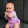 Lorraina is registered to the contest to win money with this photo: baby, bodypart, chair, clothing, couch, cushion, diaper, dress, face, finger, furniture, hand, happy, head, homedecor, person, photography, portrait, sitting, smile