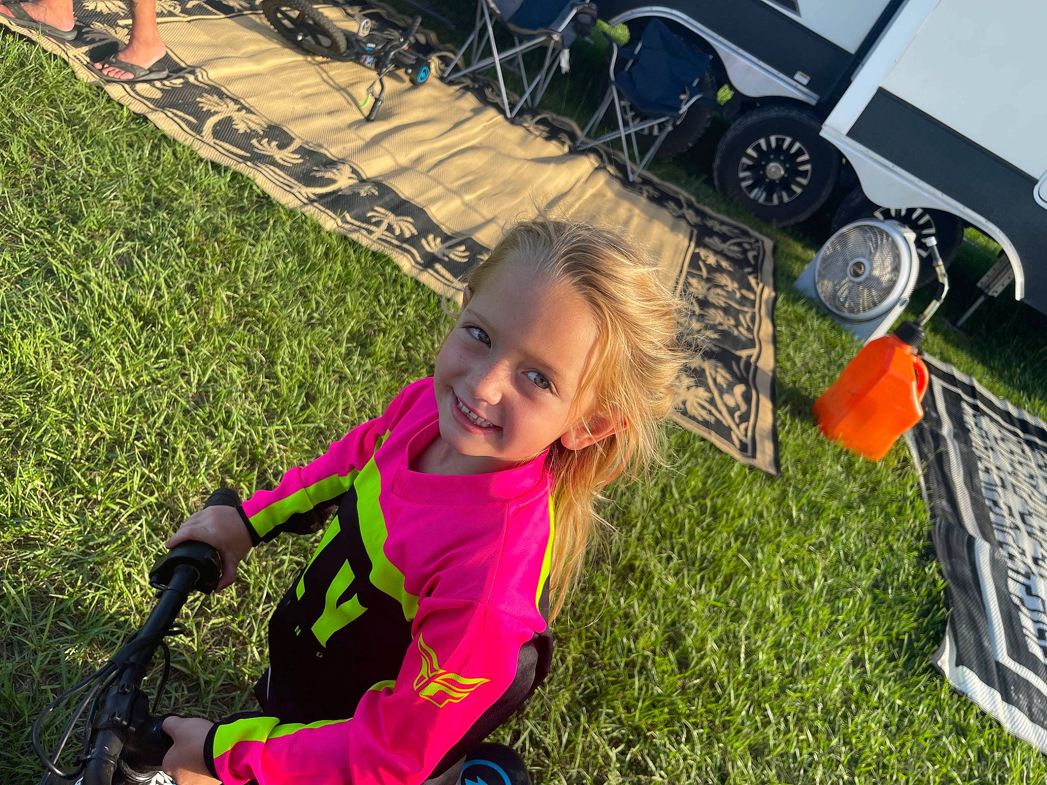 Westlyn is registered to the contest to win money with this photo: automotive_tire, child, fun, grass, grass_family, grassland, happy, joy, landscape, leisure, people, people_in_nature, person, product, recreation, smile, summer, tire, toddler, tree