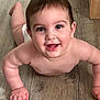 baby, child, smile, face, skin, arm, hand, floor, wood, towel, happy, lying, indoors, human, cute, infant, expression, portrait, chubby, bright_eyes