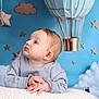 Lorenzo participe au concours pour gagner de l'argent avec cette photo : baby, infant, child, portrait, blue_background, hot_air_balloon, stars, clouds, studio_backdrop, looking_up, sweater, hands, soft_texture, cute, newborn, nursery_theme, props, photography, wonder, young_child