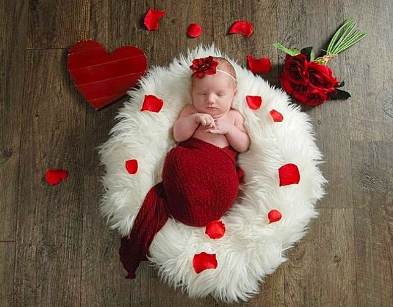 Emberlyn joined the competition — help win amazing prizes! baby, baby_toddler_clothing, christmas_ornament, comfort, costume_hat, event, eye, fur_clothing, happy, hat, headgear, holiday, human_body, lap, ornament, person, petal, plant, red, textile