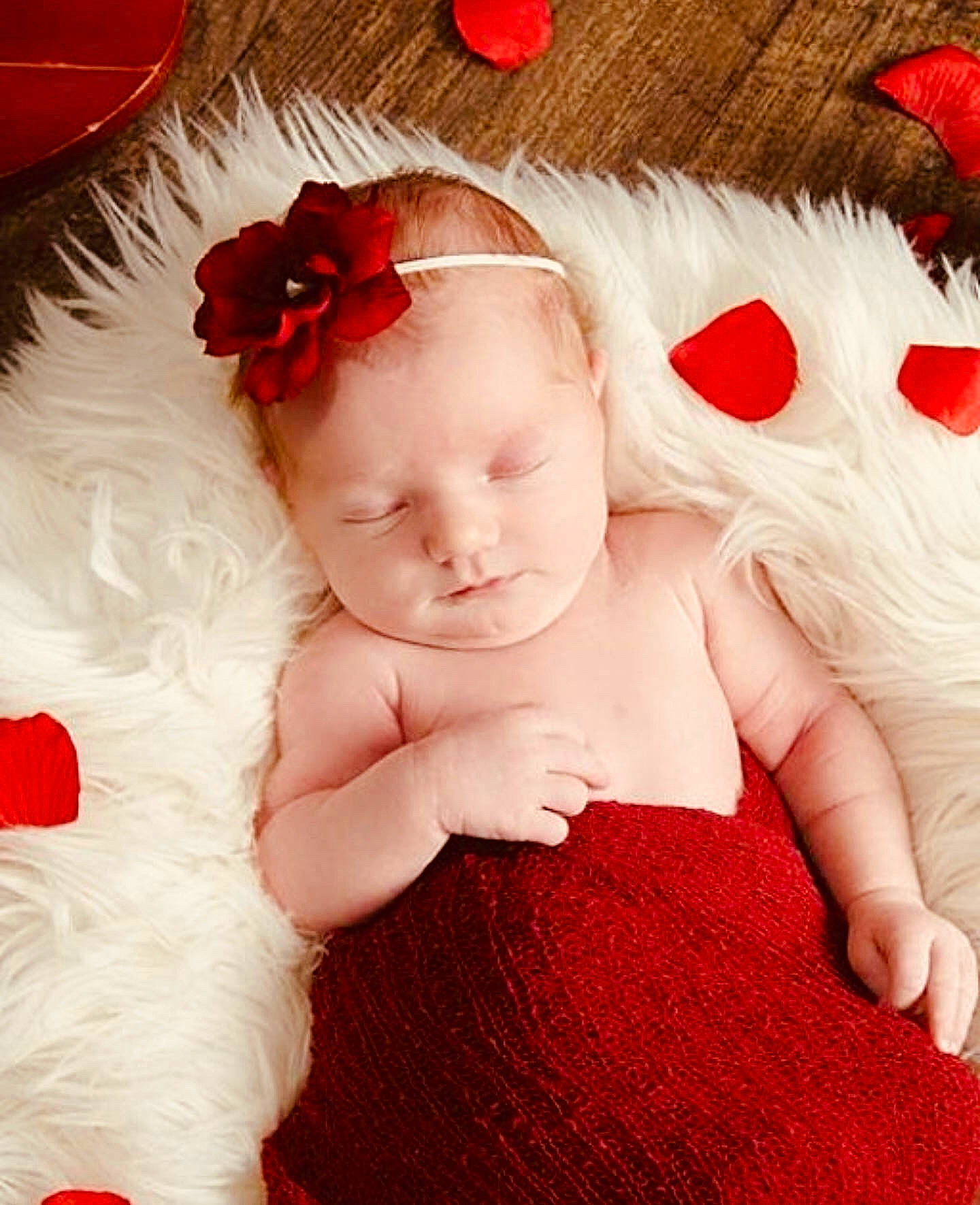 Emberlyn is registered to the contest to win money with this photo: arm, baby, baby_toddler_clothing, child, costume_hat, facial_expression, finger, hand, happy, hat, headgear, headpiece, human_body, lip, person, petal, pink, plant, red, skin