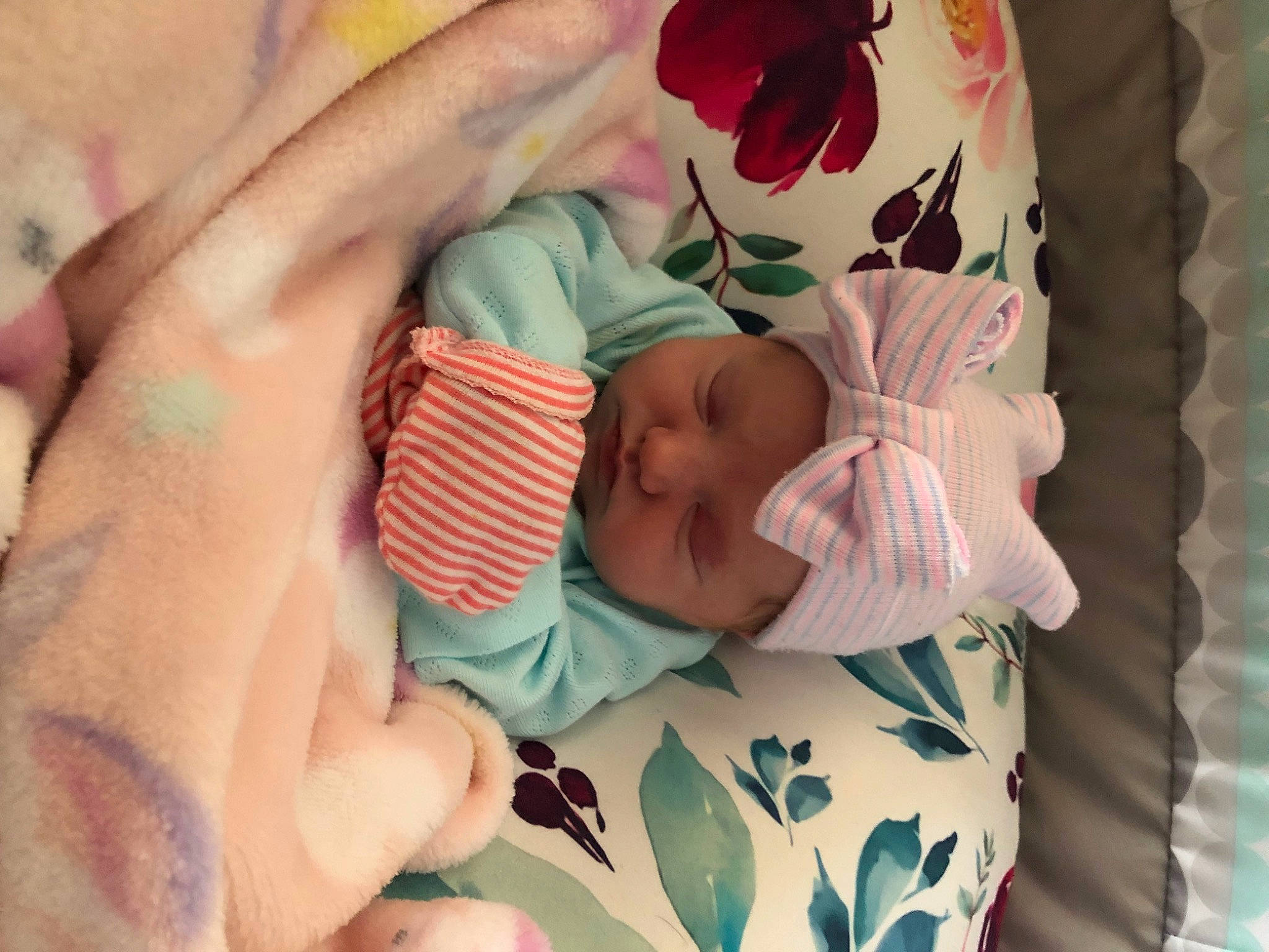 Emberlyn is registered to the contest to win money with this photo: baby, baby_products, baby_sleeping, baby_toddler_clothing, bedtime, cheek, child, comfort, eyelash, finger, hand, headwear, linens, nail, pattern, person, pink, product, skin, textile
