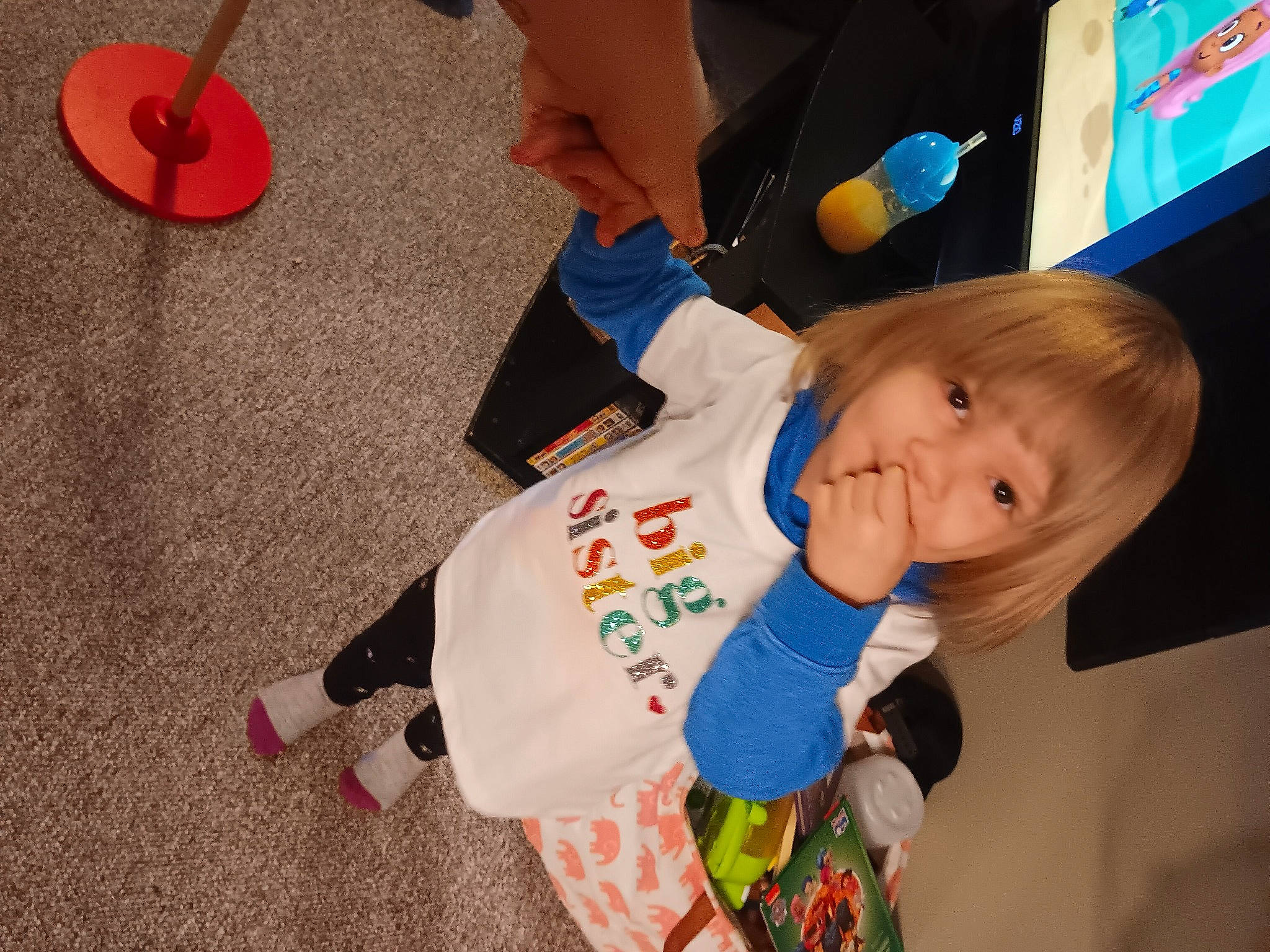 Braelynn is registered to the contest to win money with this photo: baby_toddler_clothing, carmine, child, electric_blue, event, flooring, fun, happy, human_leg, orange, person, play, room, sleeve, toddler, wood