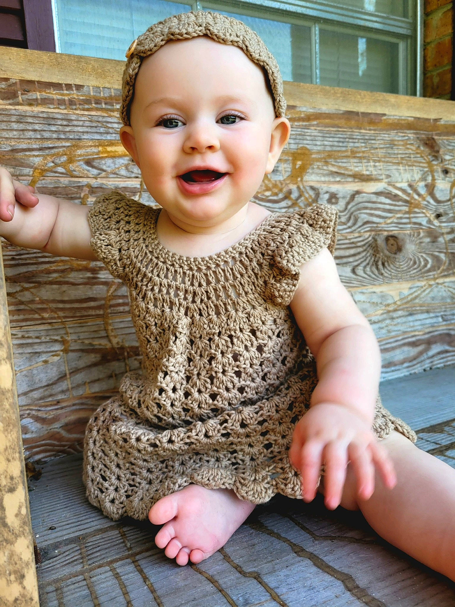 Adalynn is registered to the contest to win money with this photo: arm, baby_toddler_clothing, cheek, chin, eye, face, finger, flooring, hand, happy, head, iris, joy, lip, organ, person, photograph, skin, sleeve, smile