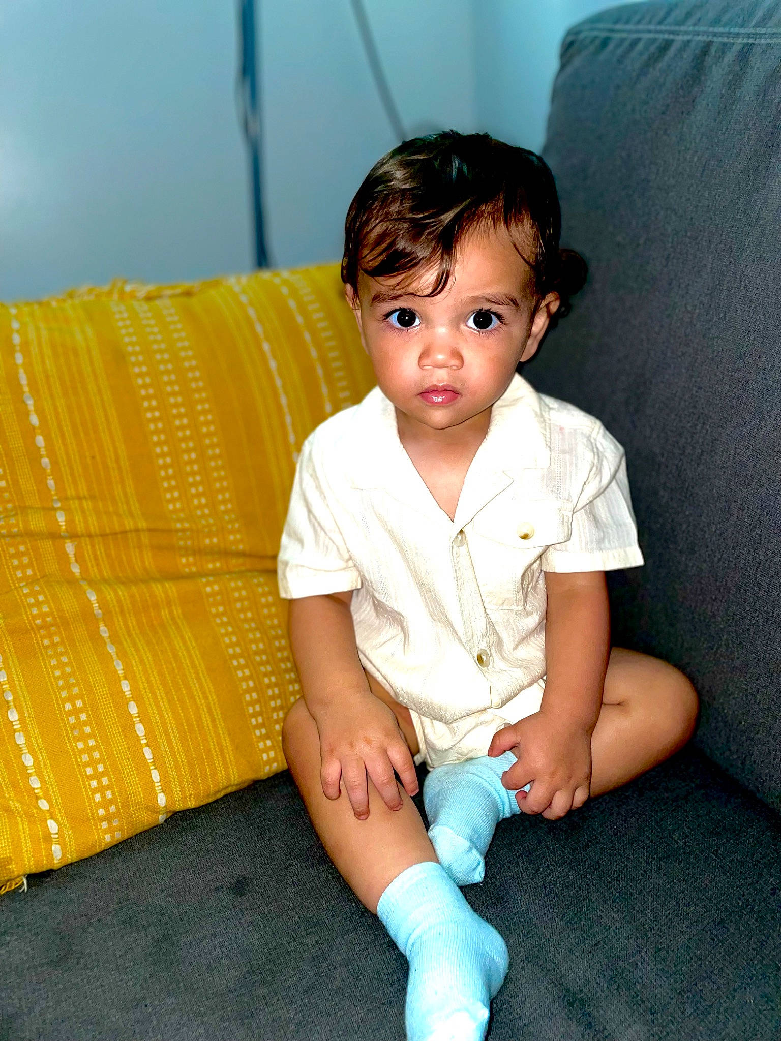 Alonzo is registered to the contest to win money with this photo: baby, baby_toddler_clothing, child, comfort, couch, elbow, electric_blue, flash_photography, flooring, fun, happy, human_leg, knee, neck, person, sitting, skin, sleeve, t_shirt, thigh