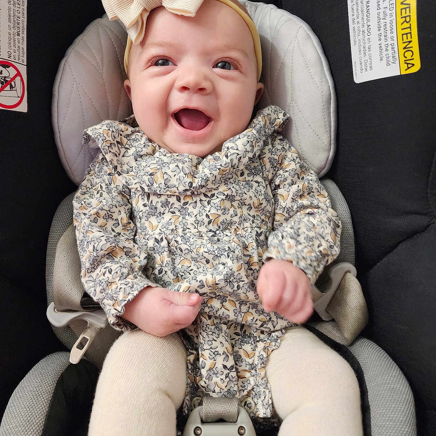 Cairo is registered to the contest to win money with this photo: baby, car, chair, clothing, coat, cushion, face, furniture, happy, head, homedecor, jacket, laughing, pants, person, photography, portrait, sitting, transportation, vehicle