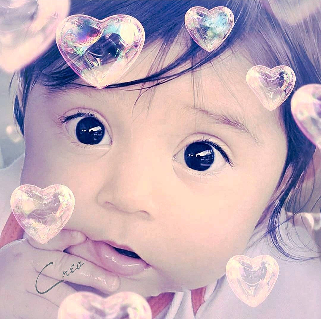 Arianna is registered to the contest to win money with this photo: bangs, black_hair, cheek, cool, ear, eye, eyebrow, eyelash, happy, head, iris, lip, nose, organ, person, pink, skin, surprise, textile, toddler