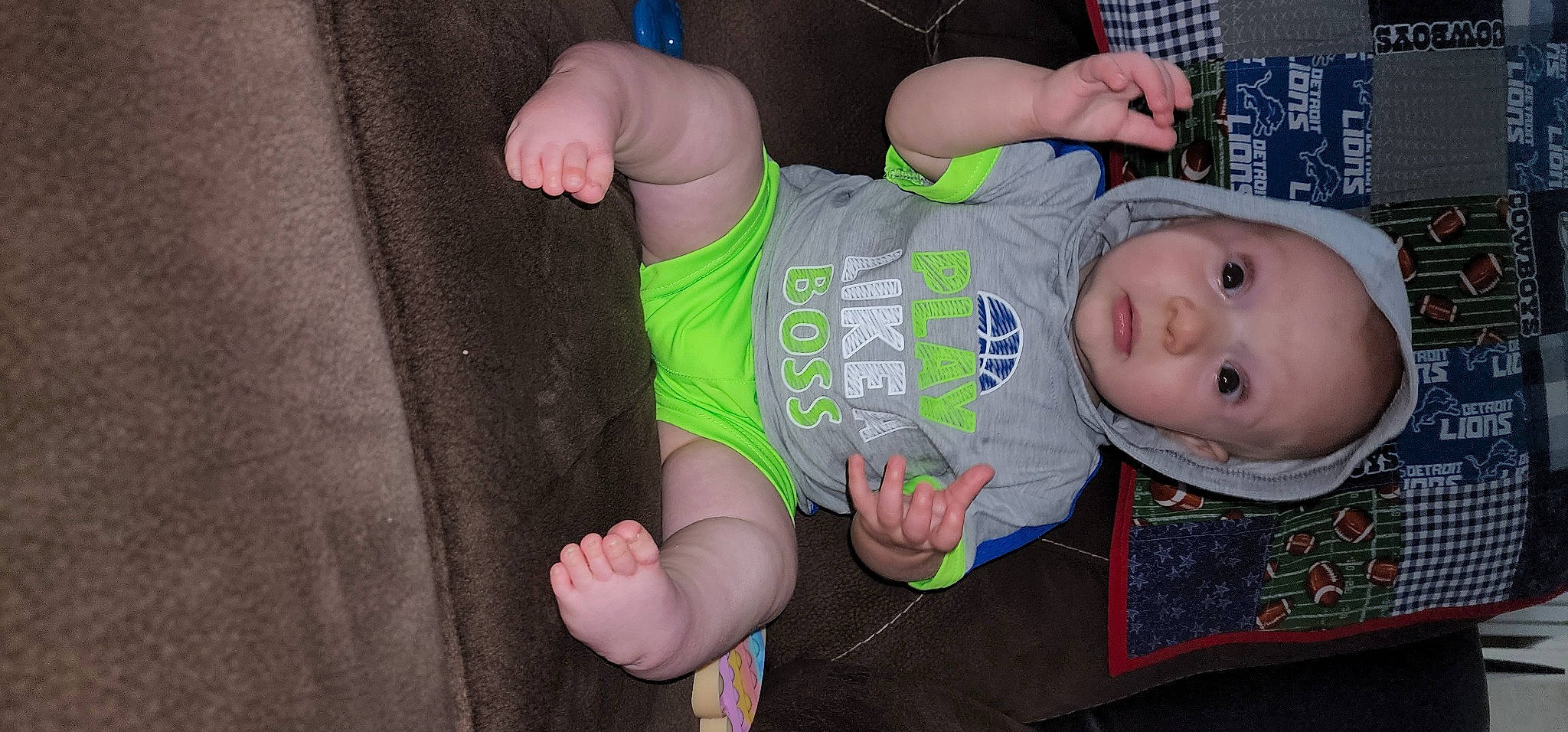 Reid is registered to the contest to win money with this photo: baby, baby_products, baby_toddler_clothing, cheek, elbow, eye, finger, fun, gesture, hand, head, human_body, human_leg, knee, mouth, person, sleeve, t_shirt, thigh, thumb