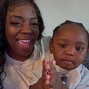 Charles joined the competition — help win amazing prizes! woman, toddler, child, smiling, clapping, indoor, person, family, happy, portrait, casual_clothing, pearl_necklace, hairstyle, closeup, skin, face, expression, baby, mother, bonding